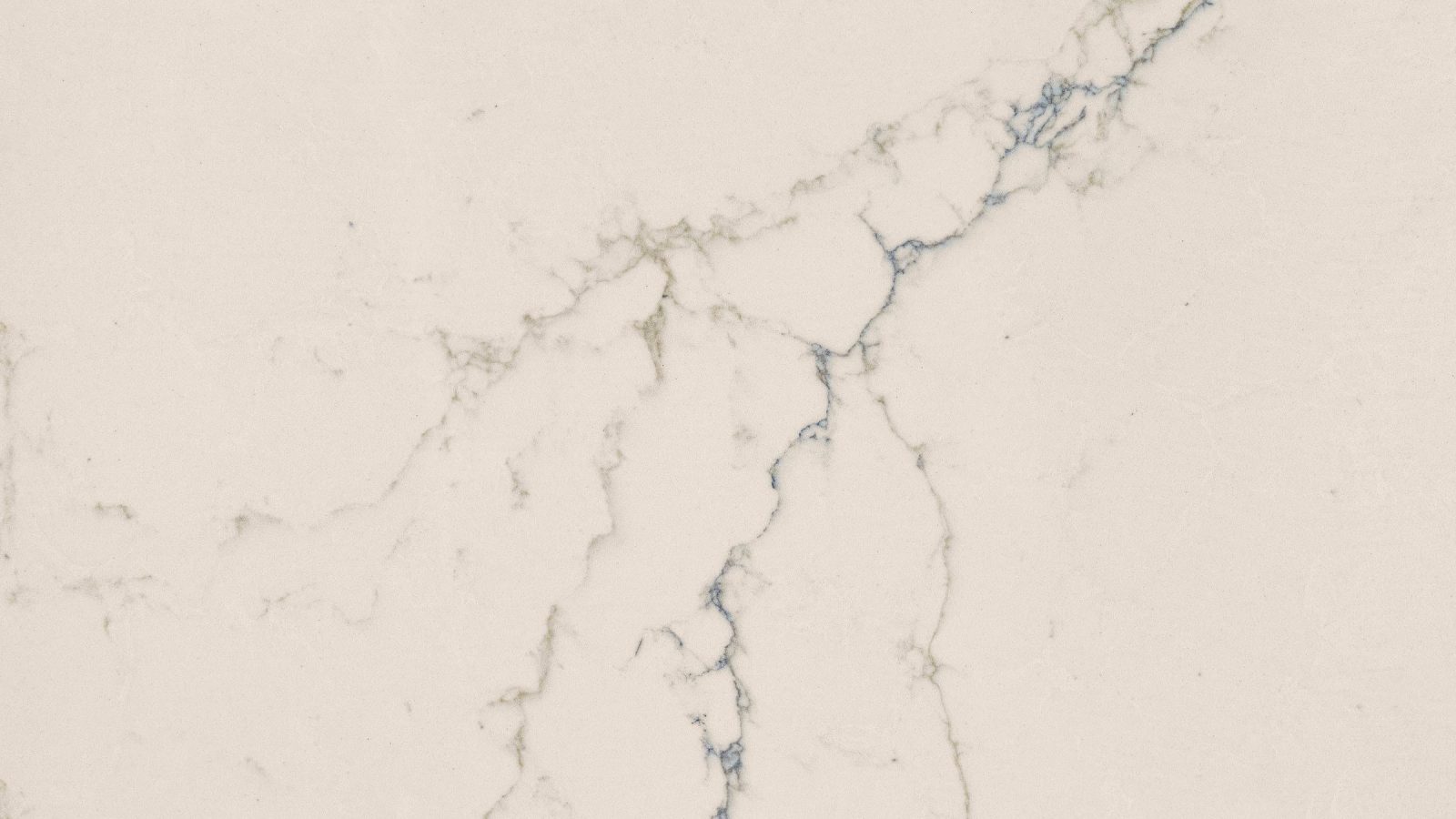 Close detail of the veining in Calacatta Lumin Blue polished quartz